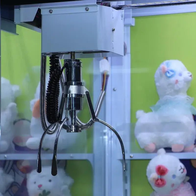 Claw machine under colorful lights